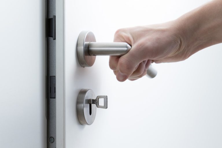 a hand opening a doorknob