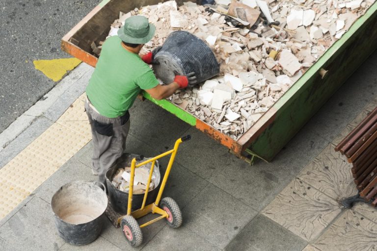 man collecting debris